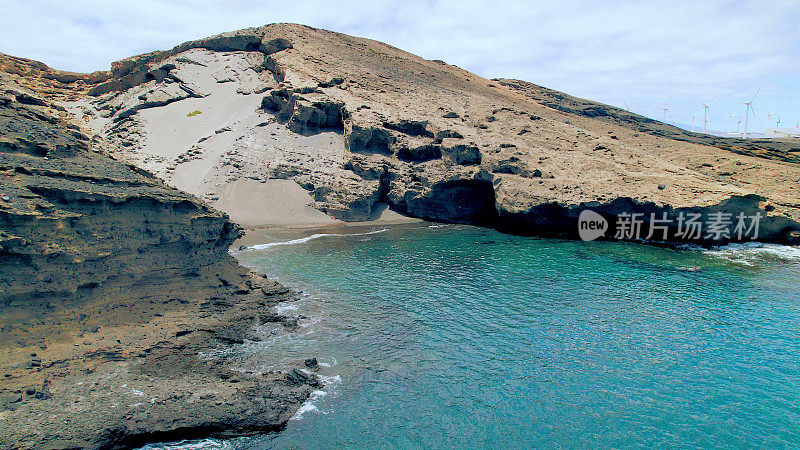 Aerial view of the hidden cove beach "La Rajita" at the natural reserve of "Monta?a Pelada" in Tenerife (Canary Islands). Drone shot